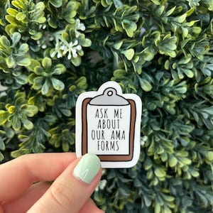 May include: White sticker with a brown clipboard design. The text on the sticker reads "Ask me about our AMA forms."
