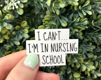 May include: White sticker with black text that reads "I can't... I'm in nursing school".