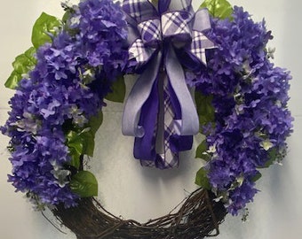 Summer Lilac Wreath. Beautiful shades of light and dark purple lilacs on a  grapevine wreath. Multiple colors of purple bow.