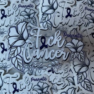 May include: A collection of stickers with a white background and black and blue ink. The stickers feature a stylized flower design and the phrase "F*ck Cancer" with a purple ribbon. Some stickers also include the text "Pancreatic".