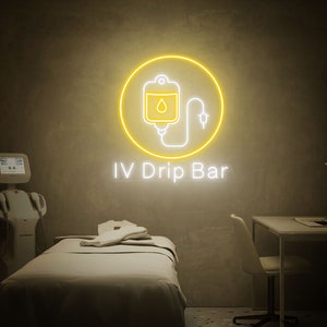 May include: A yellow neon sign with a white outline of an IV bag and a drip line. The sign reads "IV Drip Bar".