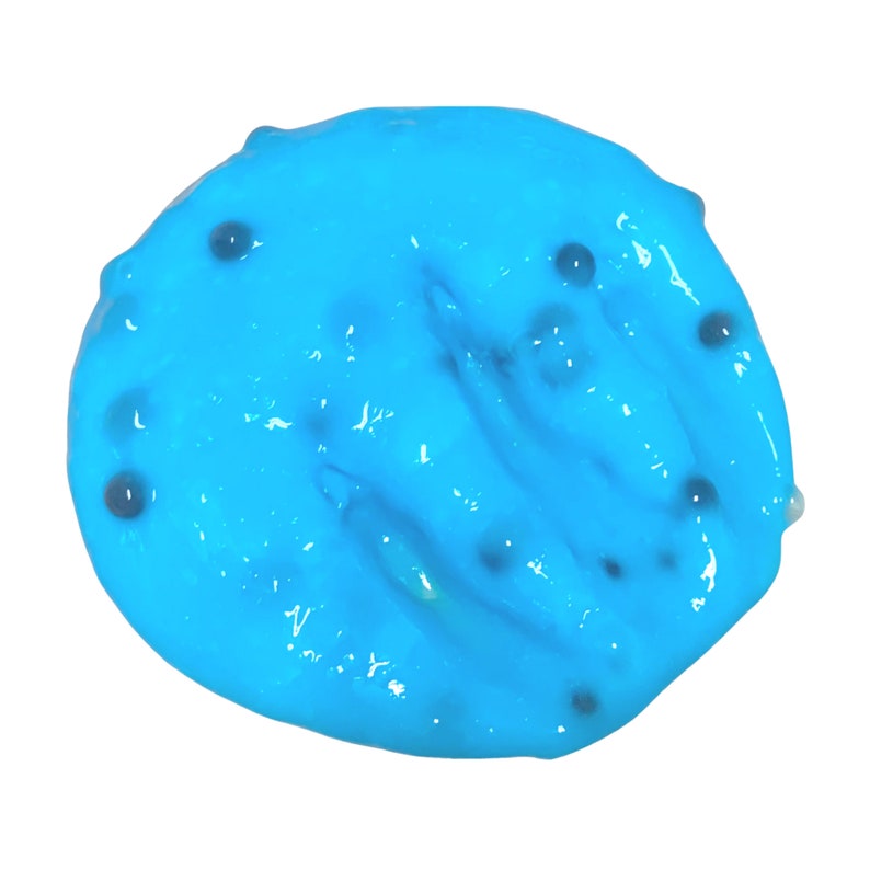 May include: A close-up of a bright blue slime with small black specks throughout.