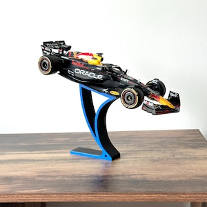 Red Bull F1 1:24 Diecast Model Car on Formula 1 Team Colour Display Stand