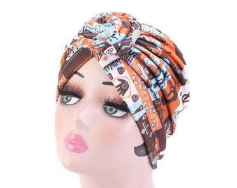 Pre tied satin lined turban in african ankara print. Knot embellished chemo headwear hat