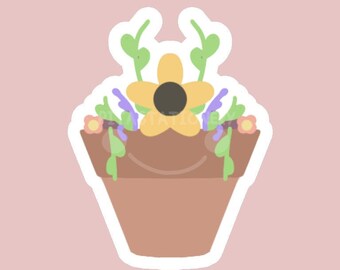 May include: A sticker of a potted plant with a yellow flower and green leaves. The pot is brown and the flower has a black centre.