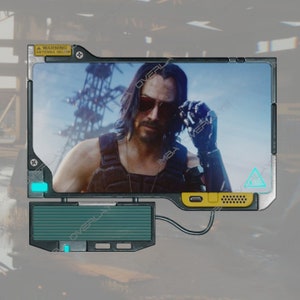 May include: A digital screen with a yellow border displays a close-up image of a man wearing sunglasses and a black tank top. The screen has a warning sign that reads "WARNING ANTENNA BELOW".
