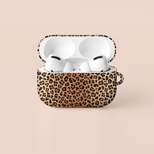 May include: A leopard print protective case for wireless earbuds. The case is open and the earbuds are visible inside.