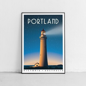May include: A vintage travel poster featuring a white lighthouse with a red roof against a blue starry night sky. The text "PORTLAND" is in a bold, art deco font at the top of the poster. The text "VICTORIA - AUSTRALIA" is at the bottom of the poster.
