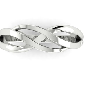May include: A silver infinity ring with a braided design.