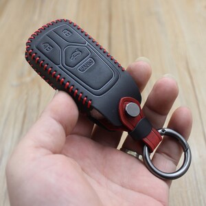 HIBEYO Intelligente Schlüsselhülle passt für Audi Autoschlüssel Hülle Leder  Schutzhülle für Audi A6L A6 A7 A8 Q7 Q8 E-Tron 3-Tasten  Autoschlüsselabdeckung Mit Schlüsselbund Schlüsseletui-A Schwarz:  : Elektronik & Foto