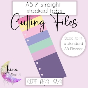 Könnte beinhalten: A5-Planer-Schneidedateien mit 7 geraden, gestapelten Laschen. Die Laschen sind in einem Regenbogen-Farbschema aus Gelb, Rosa, Lila, Grün und Hellrosa gehalten. Die Laschen sind so bemessen, dass sie in einen Standard-A5-Planer passen.
