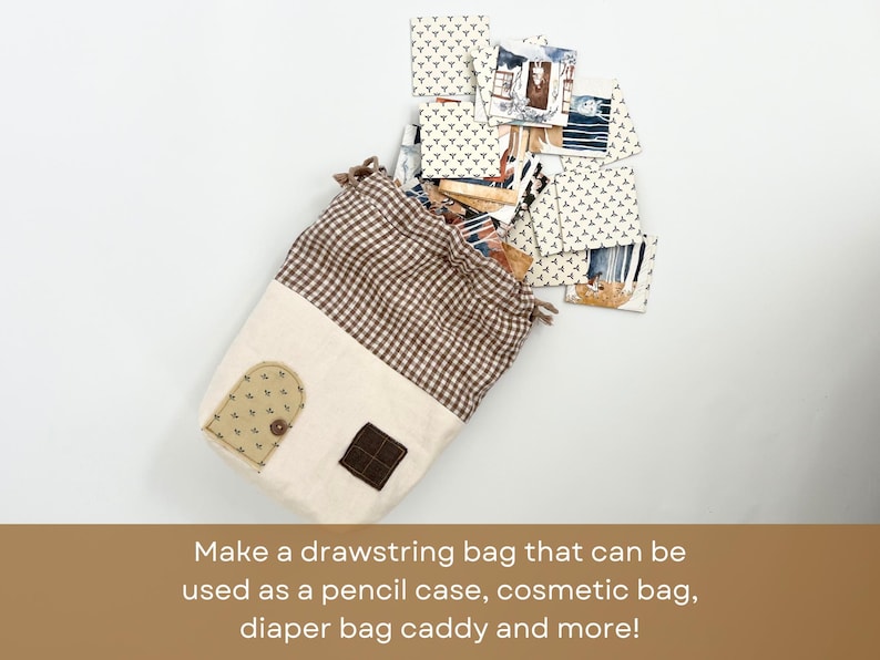 May include: A brown and white gingham drawstring bag with a beige fabric front. The bag has a small brown door-shaped patch and a beige patch with a small brown button. The bag is filled with small patterned squares of fabric.