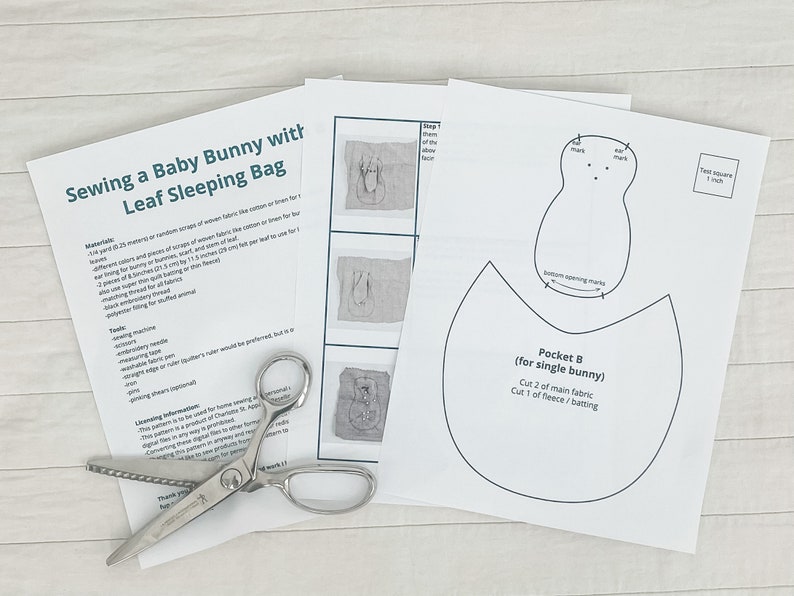 May include: Sewing pattern instructions for a baby bunny leaf sleeping bag. The pattern includes a pocket for a single bunny, with instructions to cut two pieces of main fabric and one piece of fleece or batting.