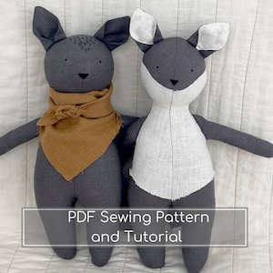 May include: Two handmade plush animal dolls. One is grey with a brown scarf, the other is grey and white. Both have long ears and stitched facial features. The text "PDF Sewing Pattern and Tutorial" is at the bottom.