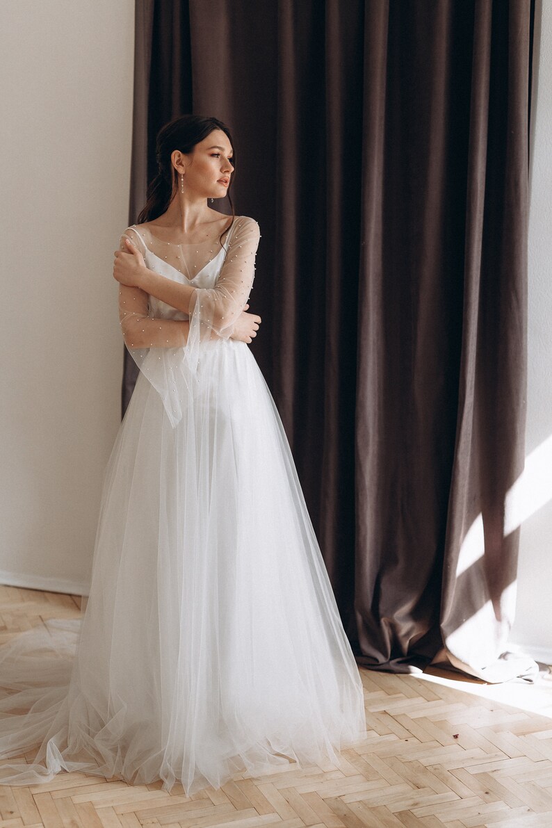 Two-piece pearl wedding dress with long flowing sleeves image 2
