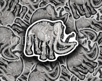 May include: A black and white sticker of a mammoth skeleton with a distressed, textured background. The sticker is a close-up of the mammoth skeleton, with its tusks and legs visible.