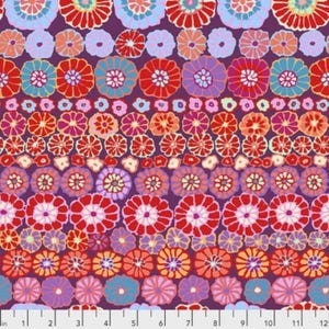 May include: A fabric pattern featuring horizontal rows of stylized circular flowers in shades of red, orange, pink, purple, and blue against a dark purple background, with a white ruler showing 30 cm along the bottom edge of the image.