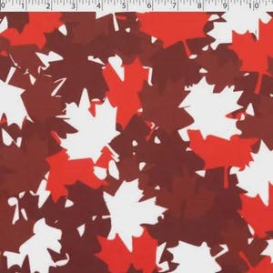 May include: A fabric pattern with a repeating design of stylized maple leaves in red, white, and burgundy. The leaves are arranged in a scattered, overlapping pattern, creating a textured effect. Suitable for craft and sewing projects, the design has a Canadian theme.