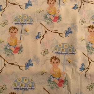 May include: Cream-colored fabric with a repeating pattern of babies, umbrellas, birds, and butterflies. The babies wear yellow tops and red boots. The umbrellas are blue and yellow. Brown branches and butterflies are also featured.