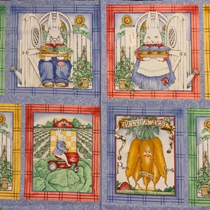 May include: A fabric panel featuring six different images of bunnies in a garden setting. Each image depicts a bunny holding a basket of vegetables, with the text "Bunnies Best" above the bunny in the centre image. The images are framed in yellow, green, and red borders.