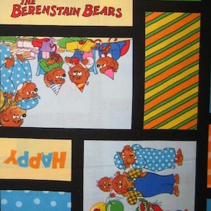 May include: A colorful fabric with a patchwork design featuring The Berenstain Bears. The fabric includes a scene of the bears celebrating a birthday with balloons, cake, and party hats. The fabric also includes a polka dot pattern, stripes, and the words "Happy Birthday".