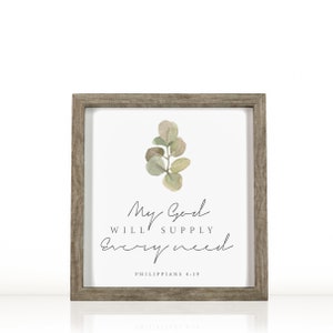 May include: A framed print with a watercolor illustration of a eucalyptus branch. The print features the text "My God will supply every need" and the scripture reference "Philippians 4:19".