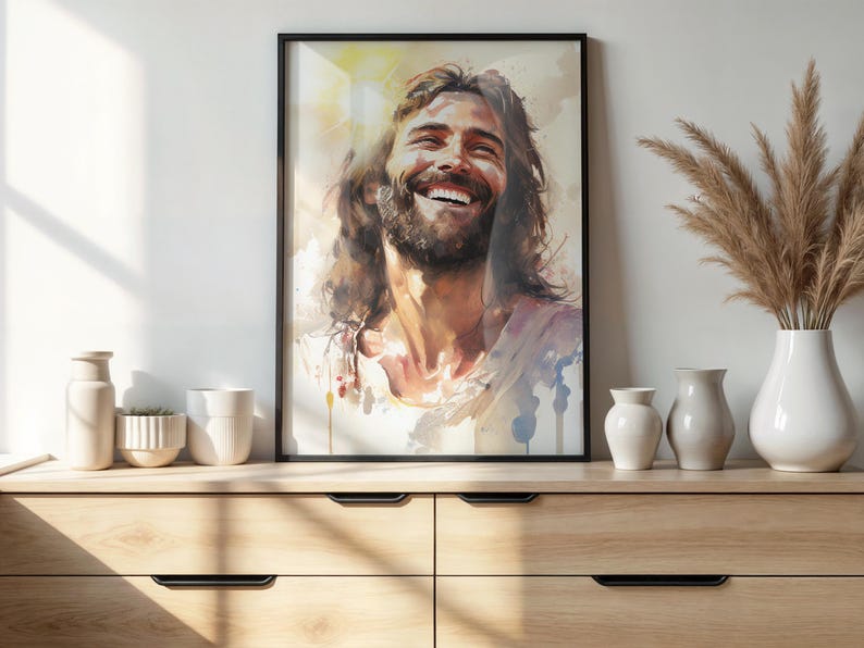 May include: A watercolor painting of a man with long brown hair and a beard smiling. The painting is in a black frame and is hanging on a white wall.