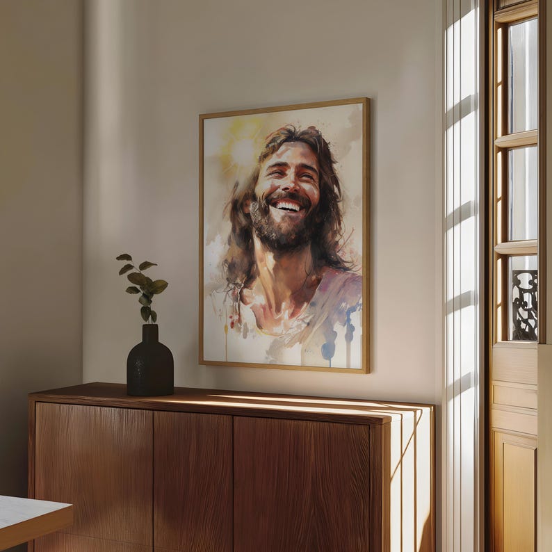 May include: A watercolor painting of a man with long brown hair and a beard, smiling with his eyes closed. The painting is in a light brown frame and is hanging on a wall.
