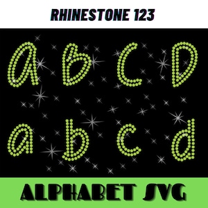 Peut inclure: Lettres de l'alphabet en strass A, B, C, D en majuscules et minuscules. Les lettres sont faites de strass verts sur un fond noir avec des étoiles blanches.