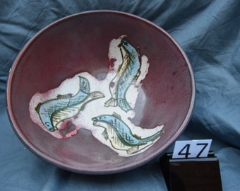 red serving bowl with fish