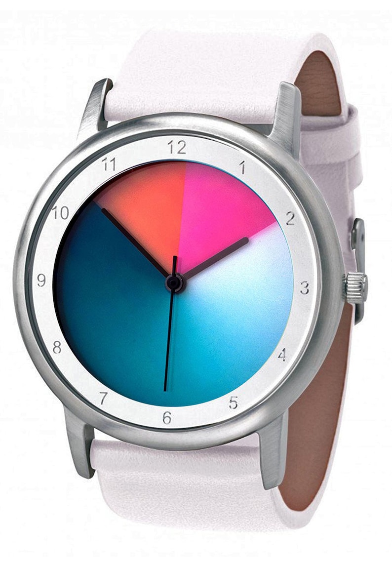 May include: A silver wristwatch with a white leather strap. The watch face has a colourful design with a blue, teal, pink, and orange gradient. The numbers 1 through 12 are printed around the edge of the watch face.