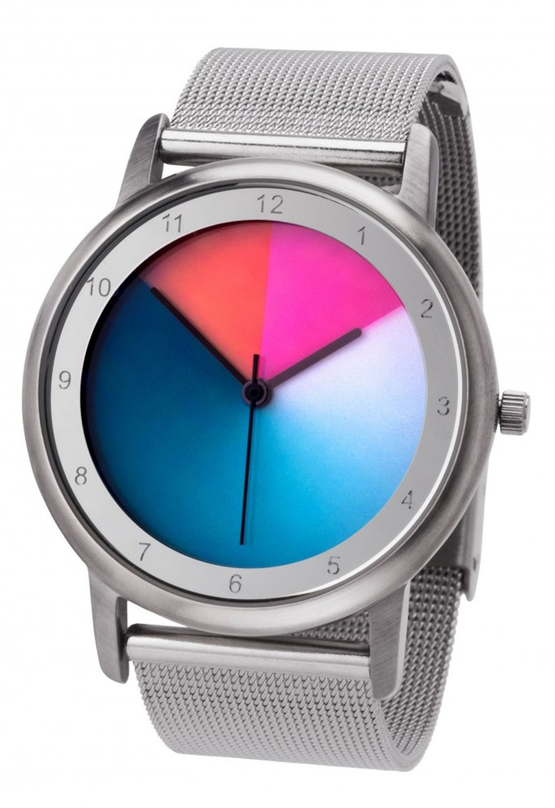 May include: A silver watch with a mesh strap and a colourful face. The face is divided into four sections, each a different colour: pink, orange, blue, and white. The numbers 1 through 12 are printed around the edge of the face.