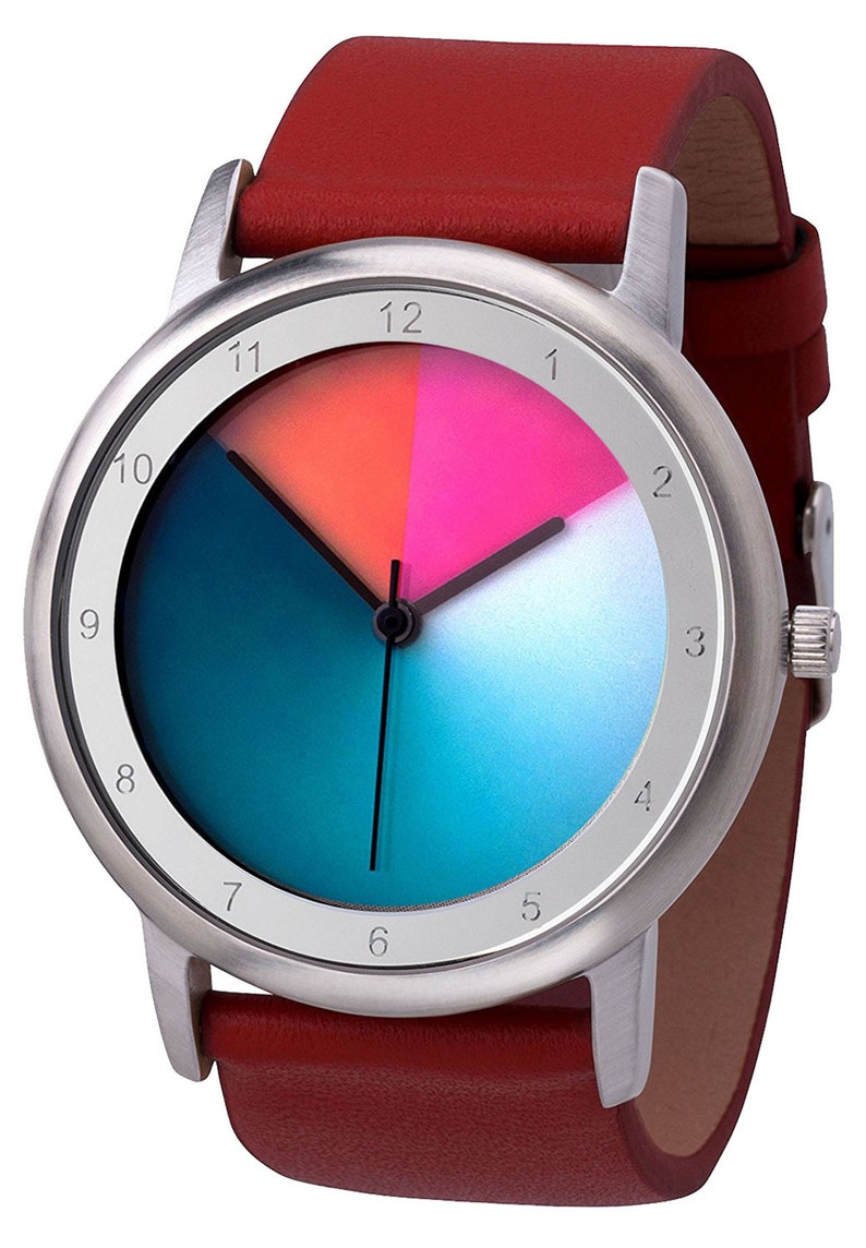 May include: A silver wristwatch with a red leather strap. The watch face has a gradient blue and teal background with a white circle in the centre. The numbers 1 through 12 are printed around the edge of the watch face.
