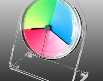 Orologio da tavolo e da mensola Petriplex Classic, in acrilico di qualità artistica, con vivaci colori CMYK, da esporre a qualsiasi ora. Dona colore e allegria alla vita.