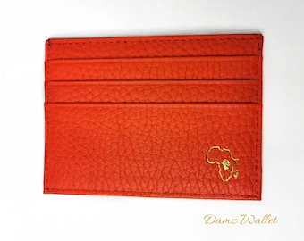 Cartera naranja afrocéntrica
