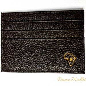 Cartera afrocéntrica marrón