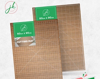 May include: Two brown self-healing cutting mats with a grid pattern. The mats are 60cm x 90cm. The text "CUTTING MAT" is printed on the smaller mat.