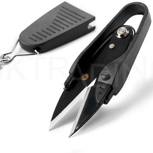 May include: Black thread snips with a black plastic case. The snips have a small silver loop for attaching to a keychain.