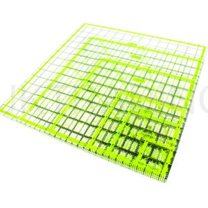 May include: A set of four clear plastic quilting rulers with green markings. The rulers are nested inside each other, with the largest ruler at the bottom and the smallest ruler at the top.