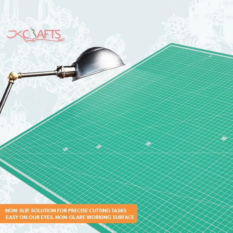 May include: A green self-healing cutting mat with a grid pattern. The mat is designed to be non-slip and non-glare, making it easy on the eyes.  NON-SLIP. SOLUTION FOR PRECISE CUTTING TASKS EASY ON OUR EYES. NON-GLARE WORKING SURFACE