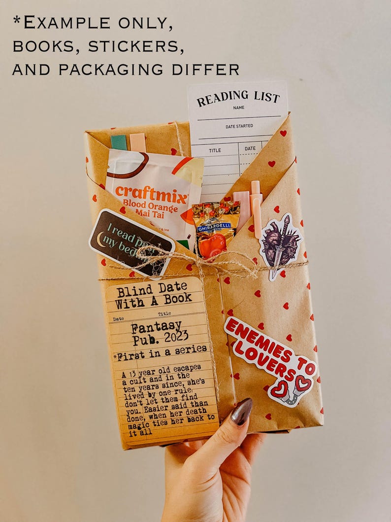 May include: A brown paper-wrapped book with a sticker that says "Enemies to Lovers" and a reading list with the title "Blind Date With A Book: Fantasy Pub. 2023 *First in a series*"
