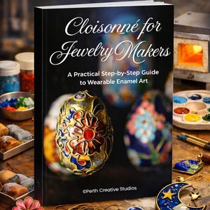 May include: A book titled "Cloisonné for Jewelry Makers" with a step-by-step guide to wearable enamel art. The cover features a detailed cloisonné egg. The image also shows jewelry-making supplies, including wire, enamel, and finished pieces.
