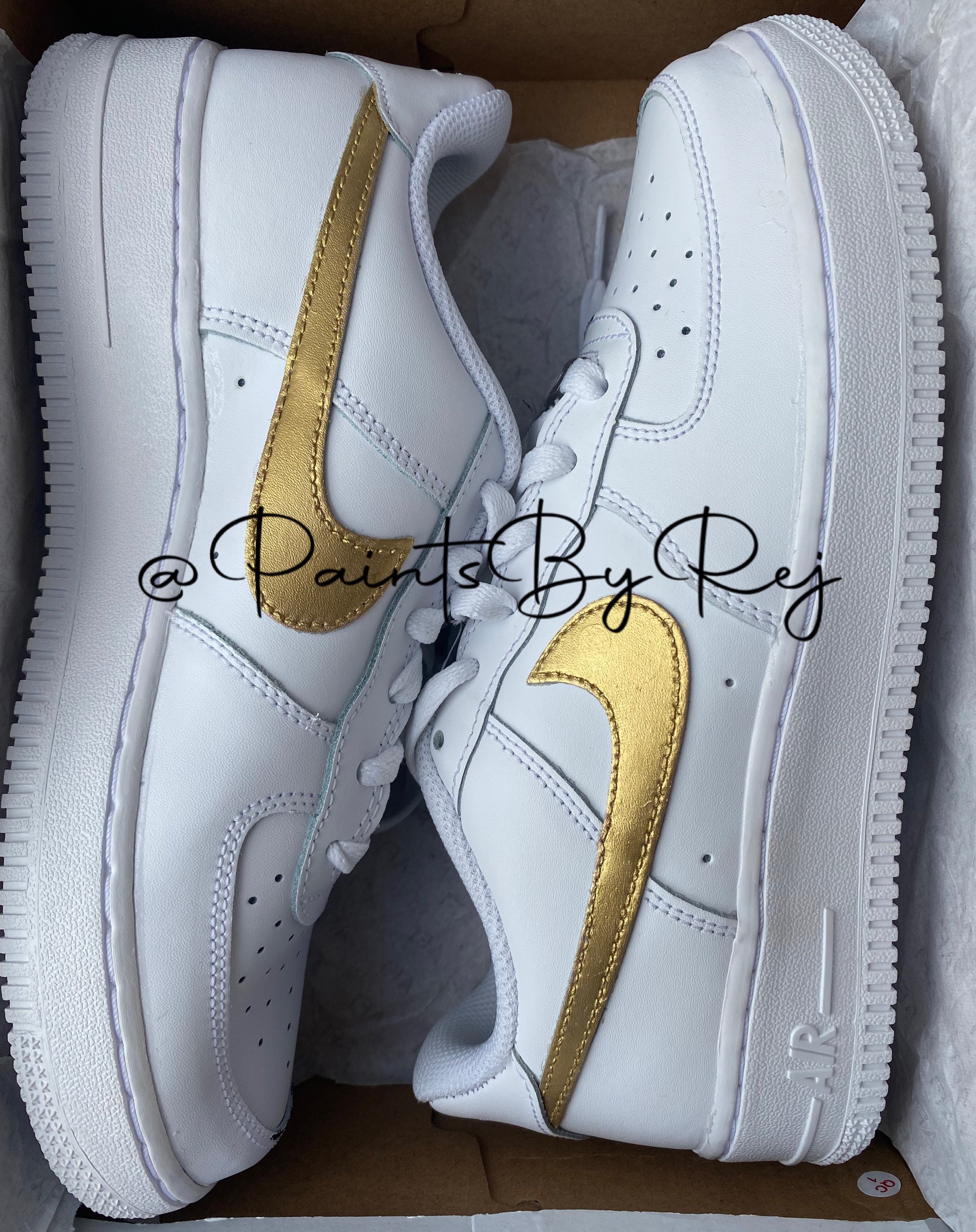 white air force with gold tick