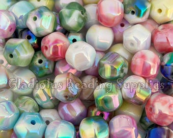 May include: A close-up shot of a pile of iridescent beads in various colors, including pink, green, blue, and white. The beads have a faceted, irregular shape and a glossy finish. The text "Gladiolus Beading Supplies" is visible.