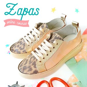 May include: A pair of beige and gold sneakers with a leopard print design. The sneakers have white laces and a white rubber sole. The text "Zapas online course" is visible in the image.