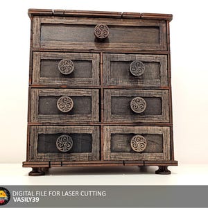May include: A wooden chest of drawers with six drawers, each with a decorative Celtic knot design on the knob. The chest is a dark brown color and has a distressed finish.