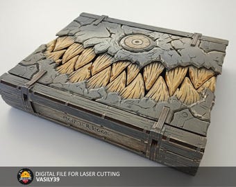 May include: A detailed, gray and tan Monster Book with a textured, cracked cover and wooden teeth design. The book has metal clasps and the title "MONSTER BOOK" is visible on the spine. A digital file for laser cutting.