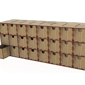May include: A wooden drawer organizer with 16 small drawers. The drawers are arranged in a 4x4 grid and are made of light brown wood with dark brown trim. One drawer is pulled out to show the interior.