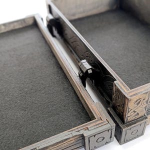 Laser cut storage box pattern shown as a completed physical item.