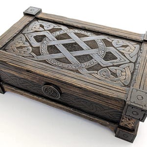 DIY laser cut project: Dark wood Celtic keepsake box with metal-look corners.